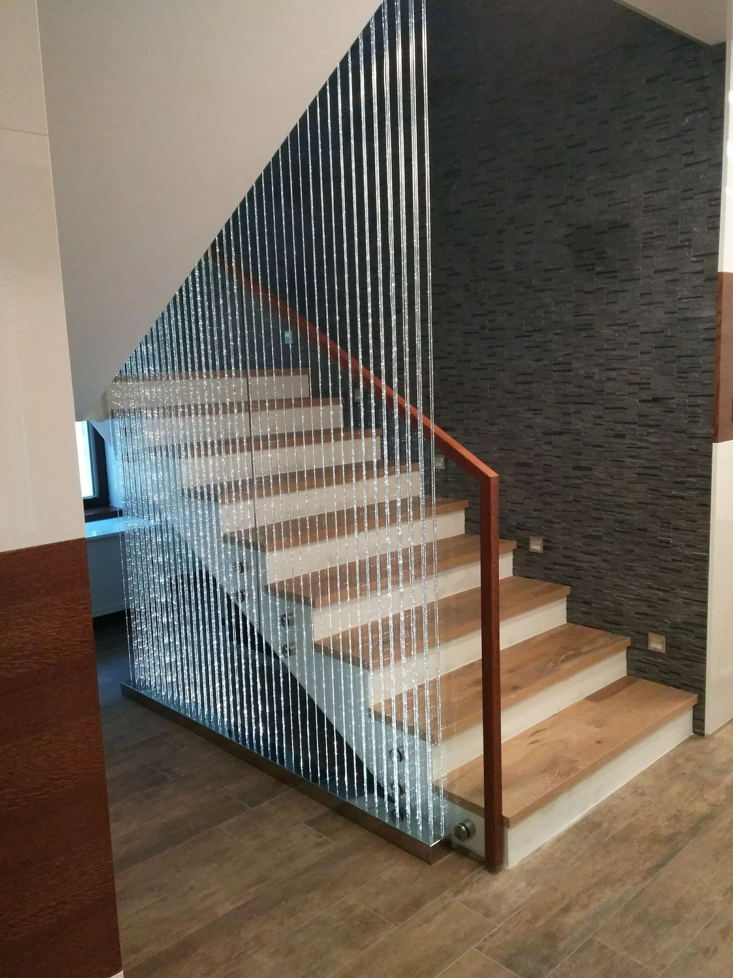 Side view on fiber optic curtain staircase in private house