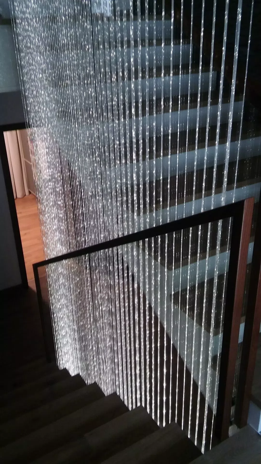 Walking down the stairs with fiber curtain is beautifull