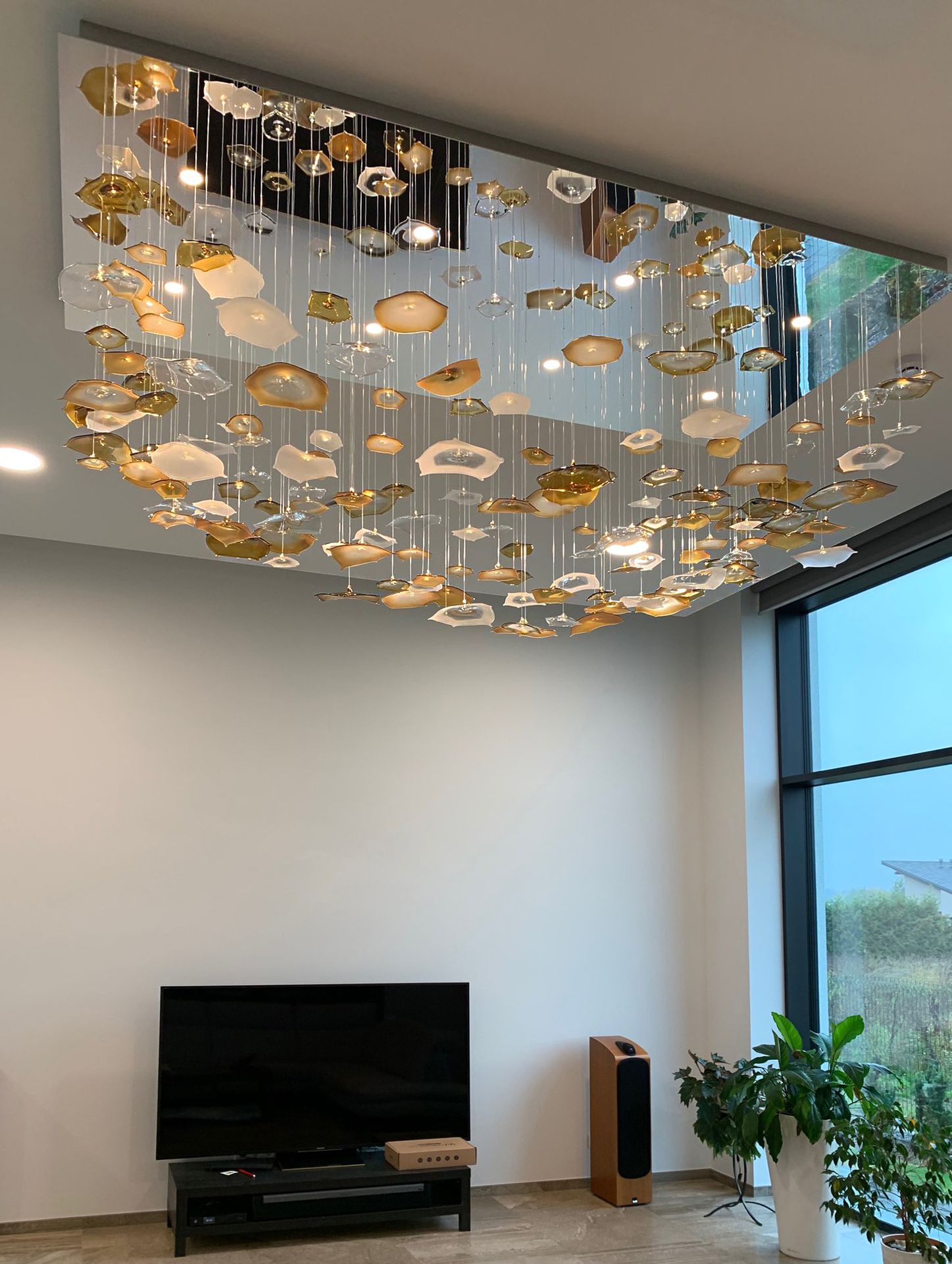 Fibre optic chandelier with organic shaped glass parts