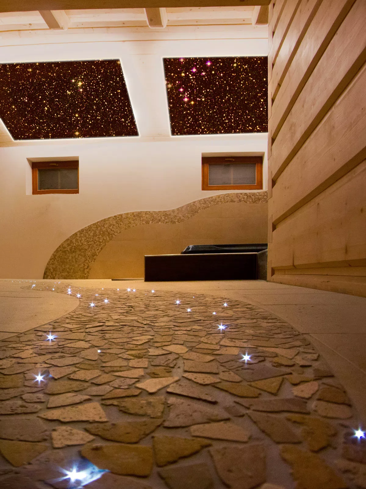 Fibre optics as starry sky in the ceiling and walkover in between mosaics at floor 