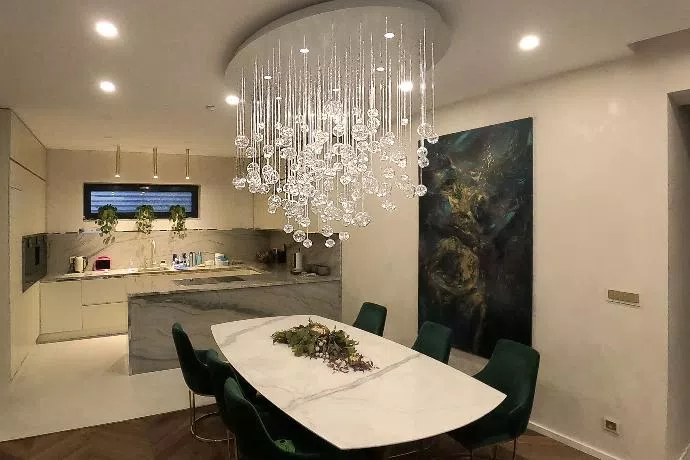 Dining table beautified by modern Aquila fiber optic chandelier