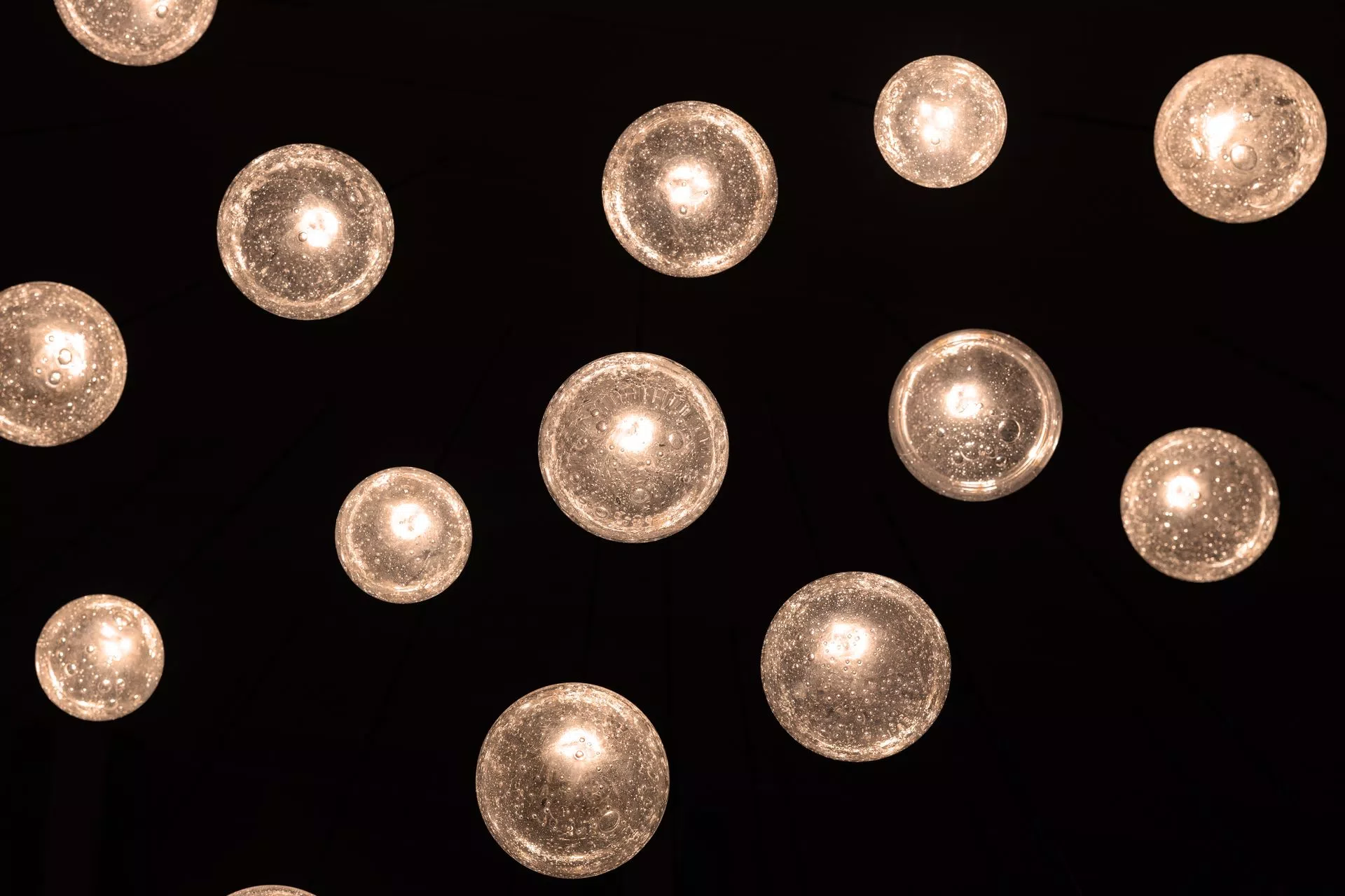 Soda glass ball design ELUDA from bottom in tall livingroom-view from sofa