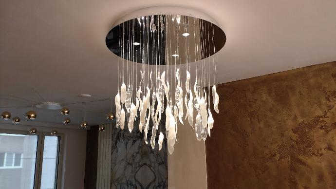 Fiber optic hand blown glass chandelier round base in dinning room, fiber optics and mini LED downlights are ON