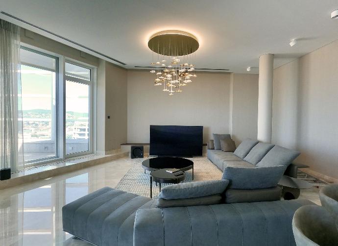 LED infinito with indirect LED lighting in rooftop appartment in livingroom