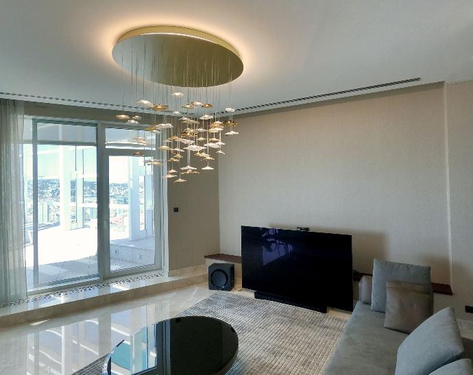 Livingroom luxury LED chandelier with view on pethouse terace