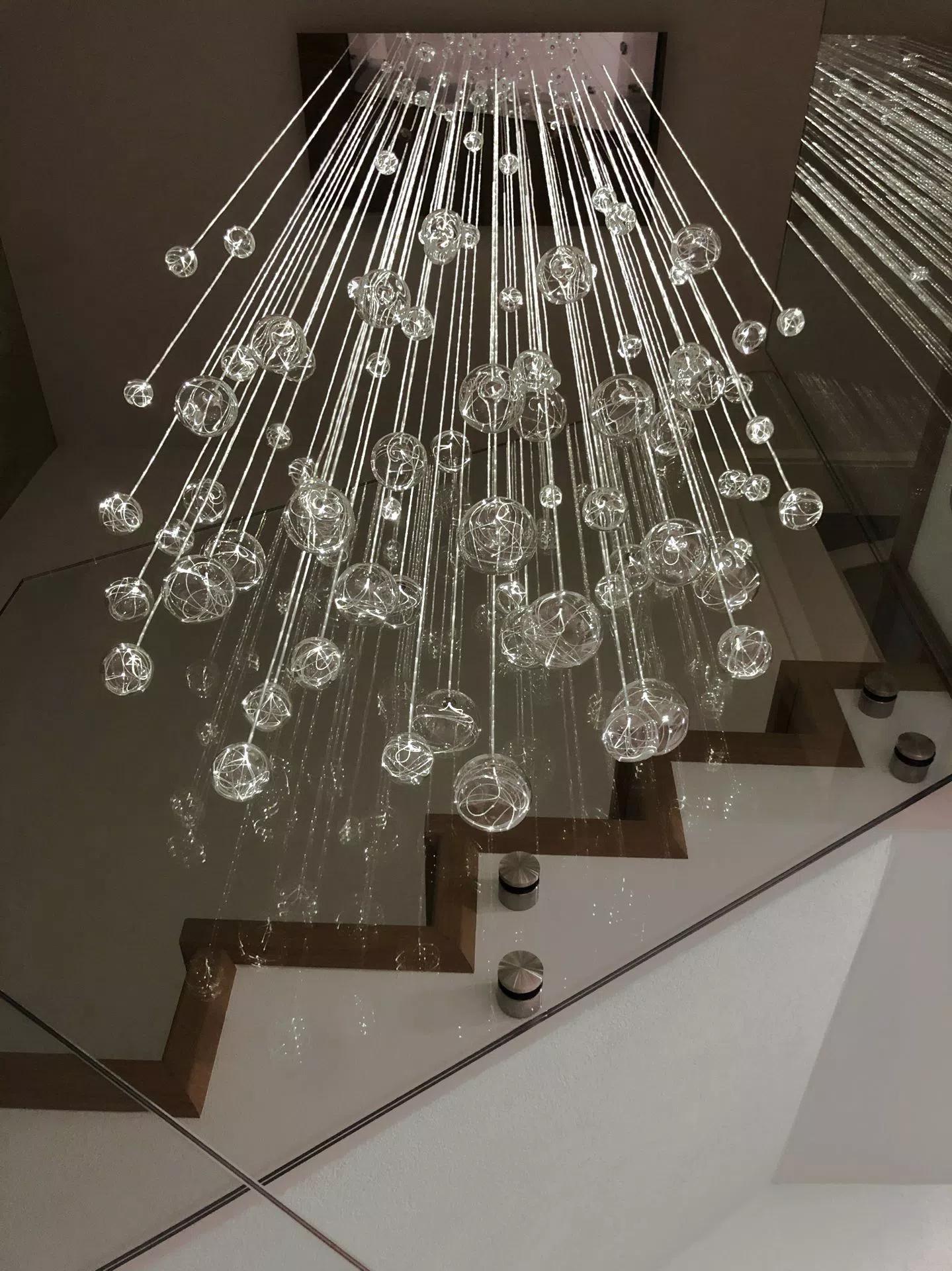 AQUILA fibre optic chandelier without downlights lit showing only light passing through fibre optics into glass balls