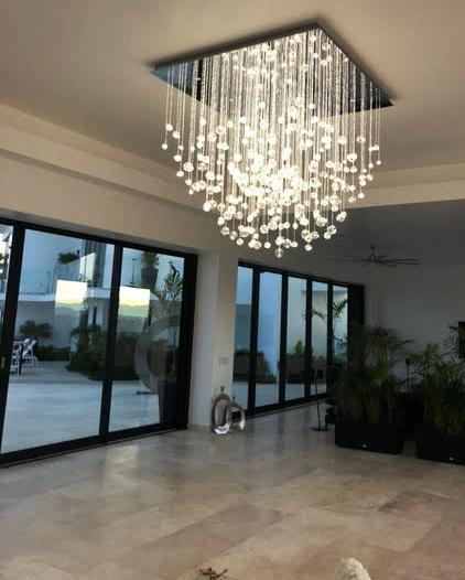 Down view of fibre optic chandelier AQUILA in entrance hall luxury villa