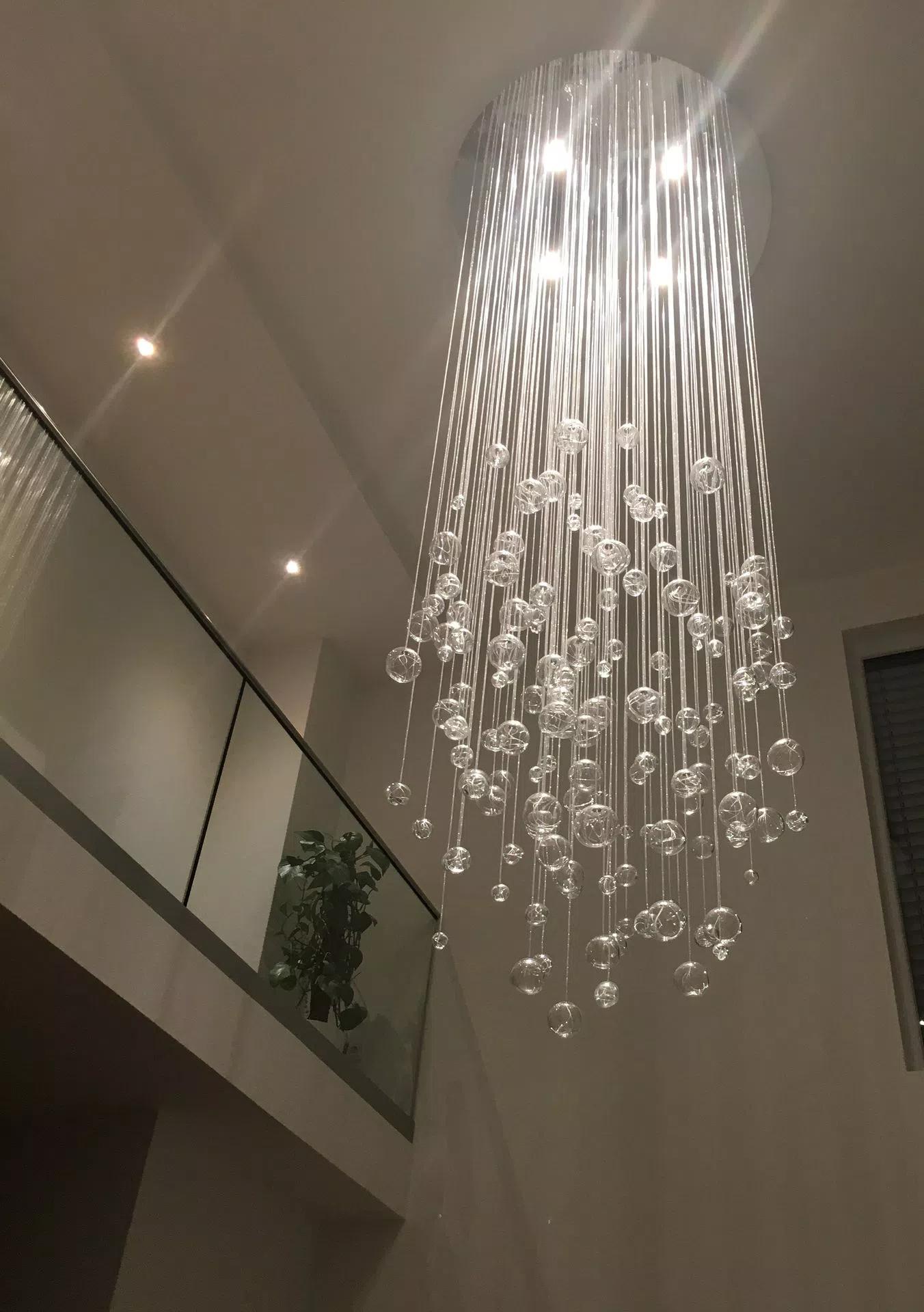 4m tall chandelier in livingroom on sloped ceiling fibre optic design with LED downlights