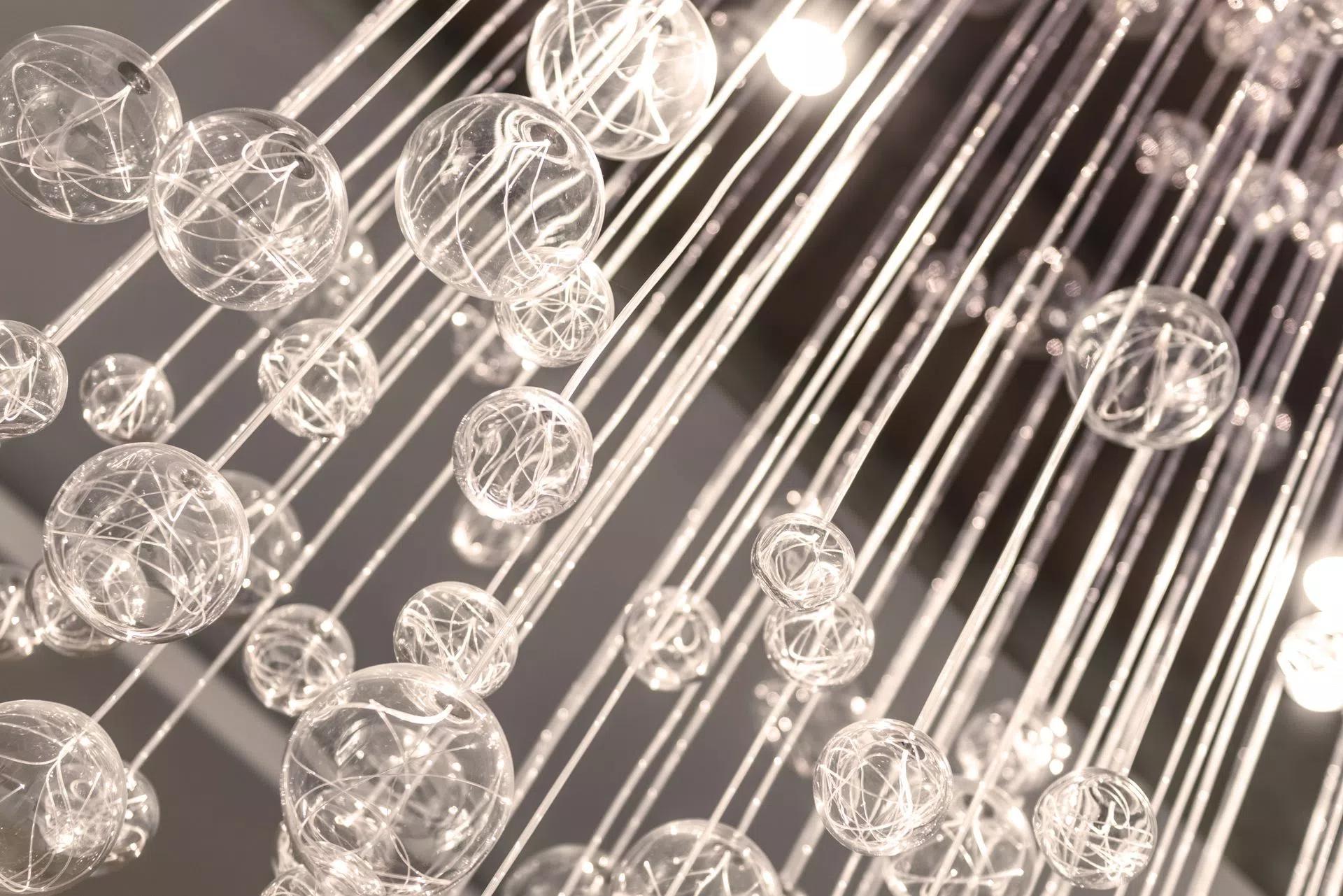 Glass sculpture hanging on fibre optics view