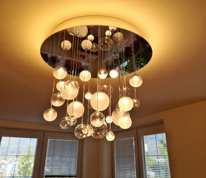 Modern CCT adjustable human centric lighting chandelier installed in kitchen in warm white colour