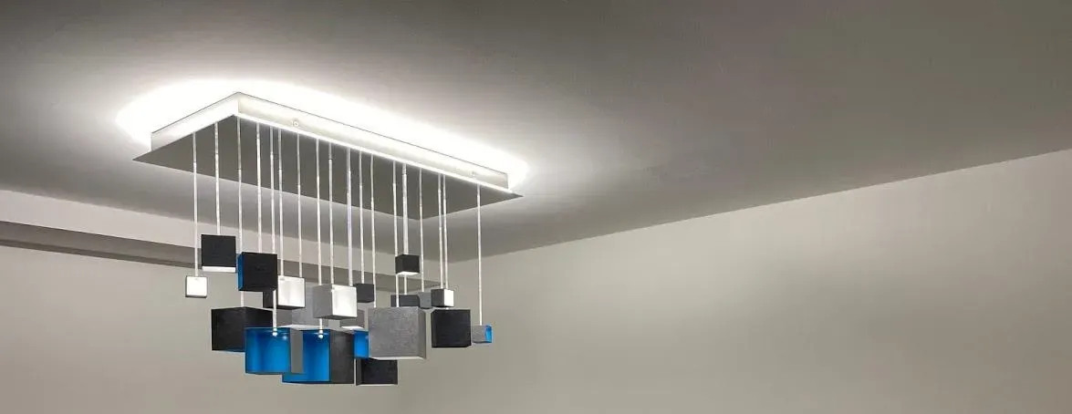 Modern light rod chandelier blends in the interior