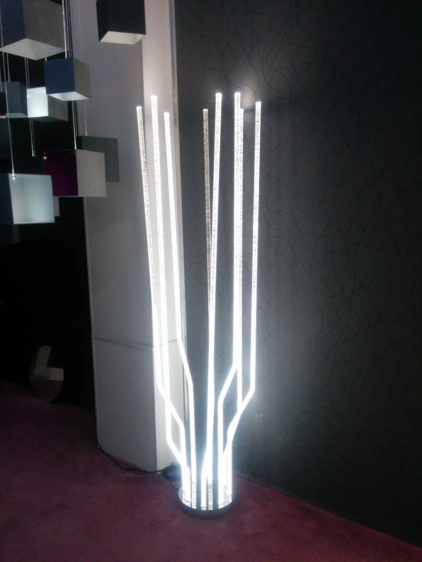 TREA floor lamp made of fibre optic light rods 2m tall lamp in interior showroom