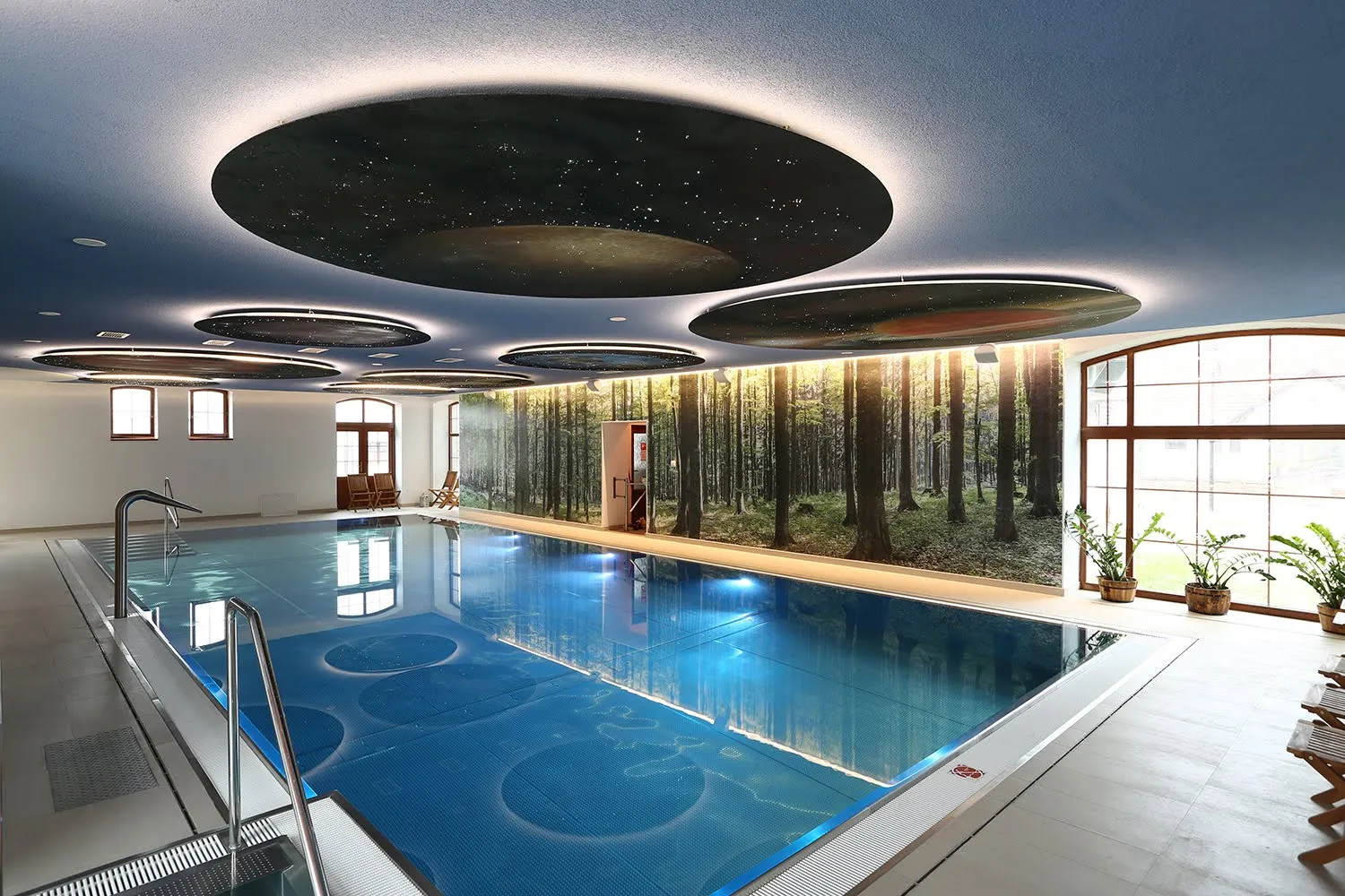 Hotel wellness spa LED lighting with integrated fibre optic starry sky in heliocentric planet like shapes with artistic paintings